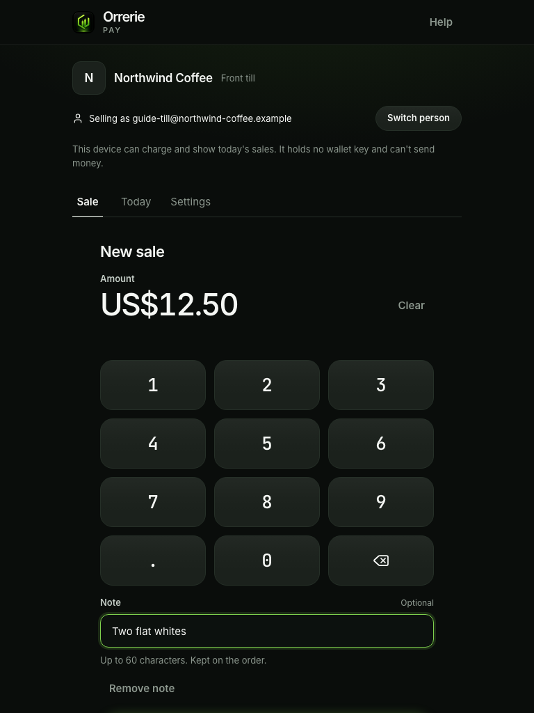The till's keypad on a tablet with US$12.50 typed, a note, and Charge US$12.50.