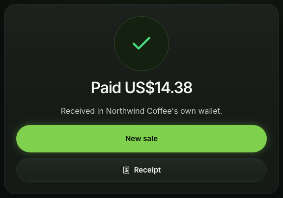 The till's full screen after the network confirmed the payment: Paid US$14.38 with a tick, New sale and Receipt.